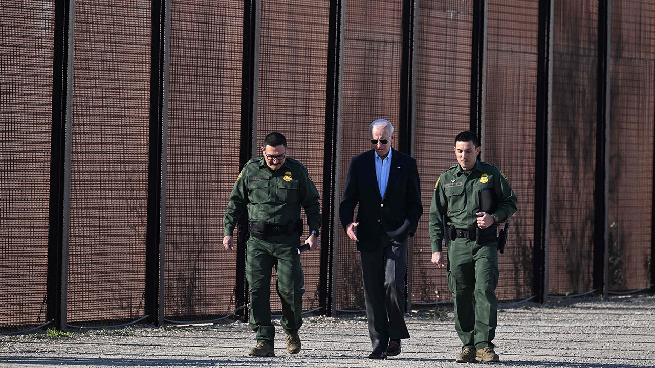 President Biden walking with border officials