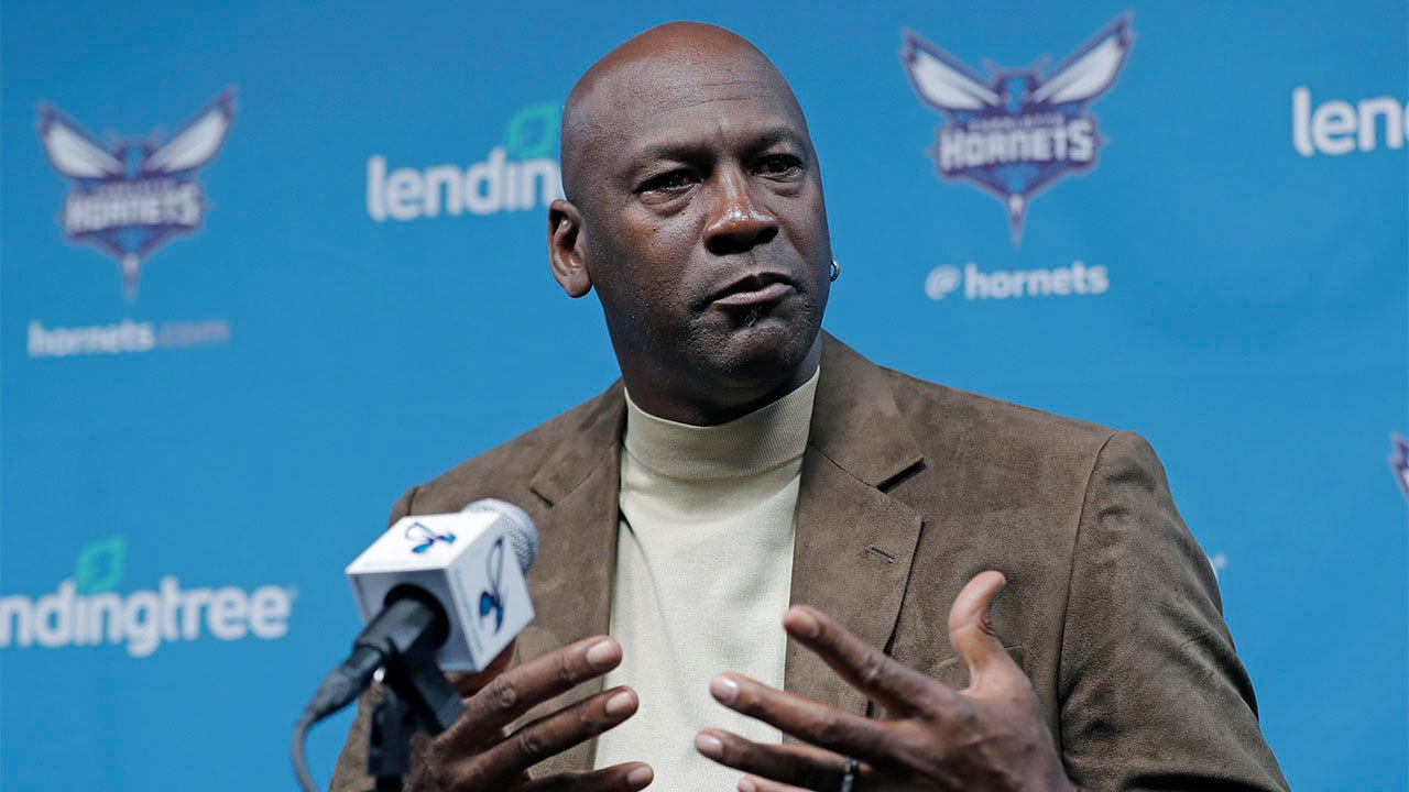 Michael Jordan talks to the media