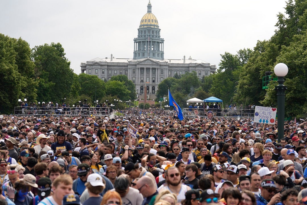 2 shot, Denver police officer hit by fire truck during Nuggets NBA championship parade
