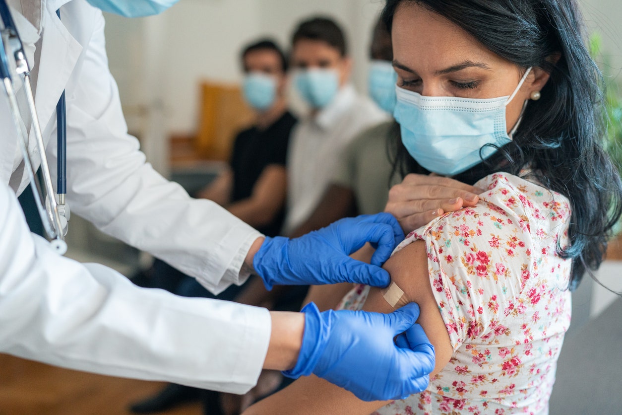 Woman getting vaccine