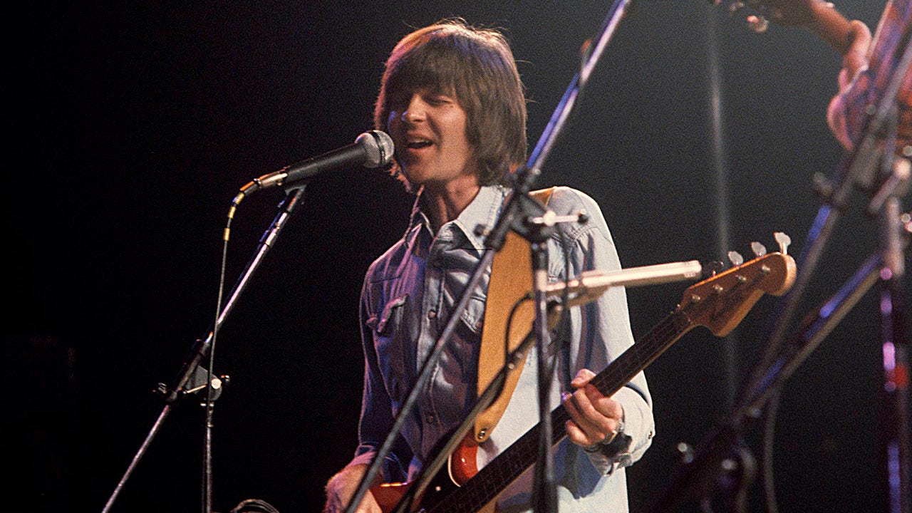 Randy Meisner playing with The Eagles on stage