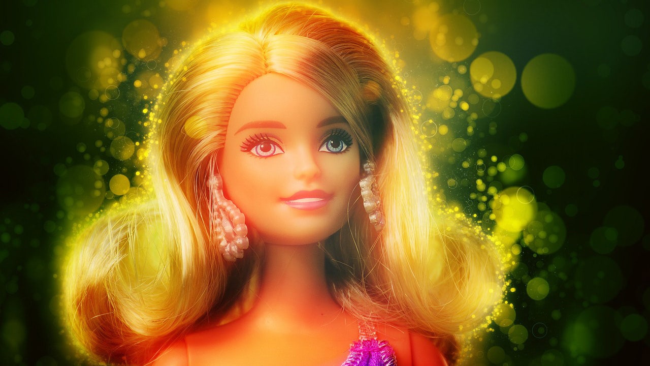 Photo of a Barbie doll looking off into the distance.