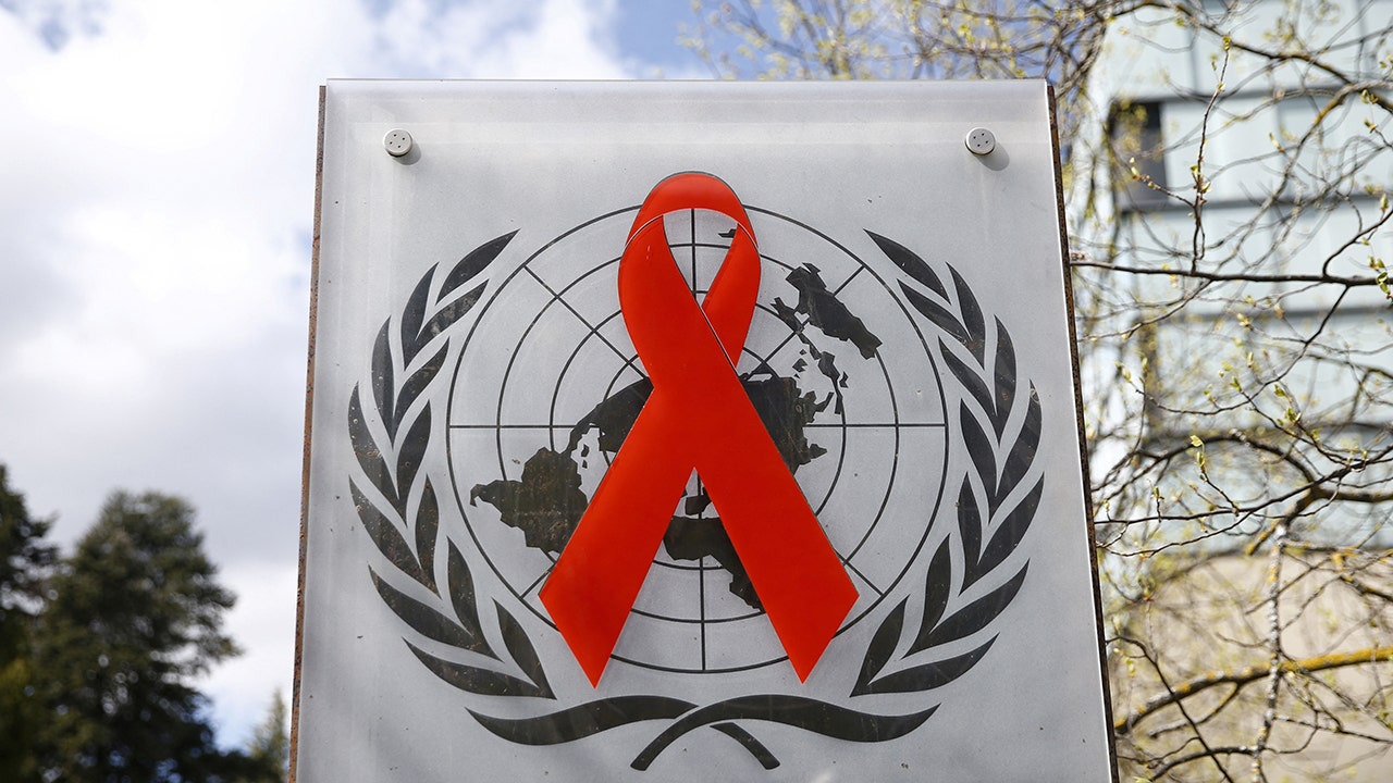 A logo is pictured outside a building of the United Nations AIDS agency 