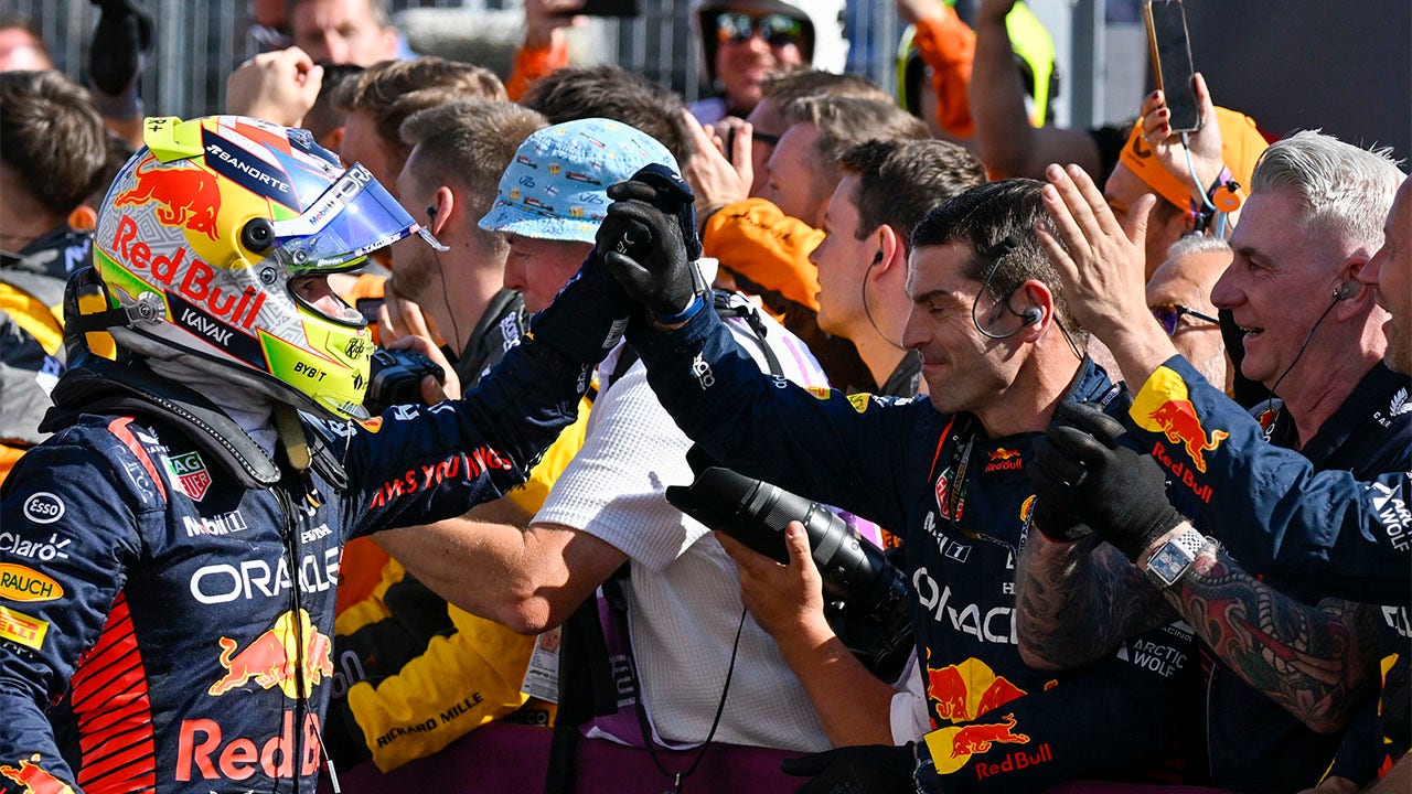 Sergio Perez celebrates with team