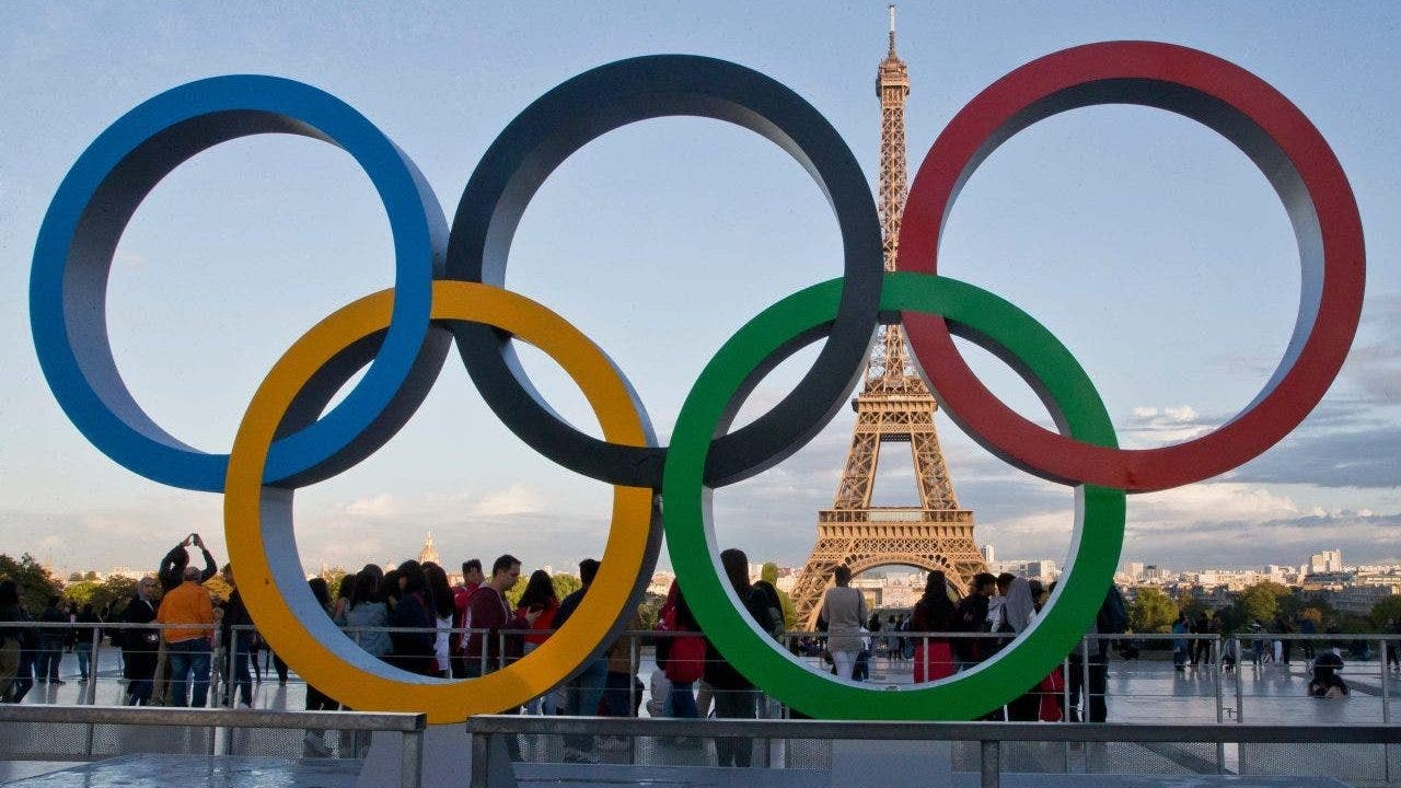 FILE - The Olympic rings are set up at Trocadero plaza that overlooks the Eiffel Tower, a day after the official announcement that the 2024 Summer Olympic Games will be in the French capital. (AP Photo/Michel Euler)