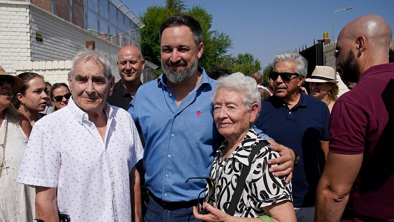 Vox party leader Santiago Abascal poses with voters