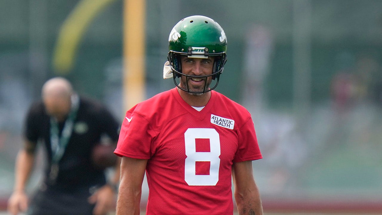 New York Jets quarterback Aaron Rodgers (8) calls out a play to his  teammates during the first half of an NFL preseason football game against  the New York Giants, Saturday, Aug. 26