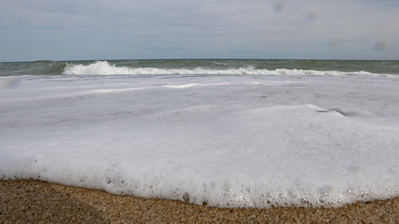 Marconi Beach sea foam on the shores