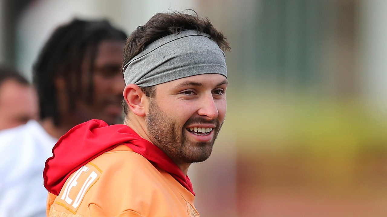 Baker Mayfield smiles during a training camp session