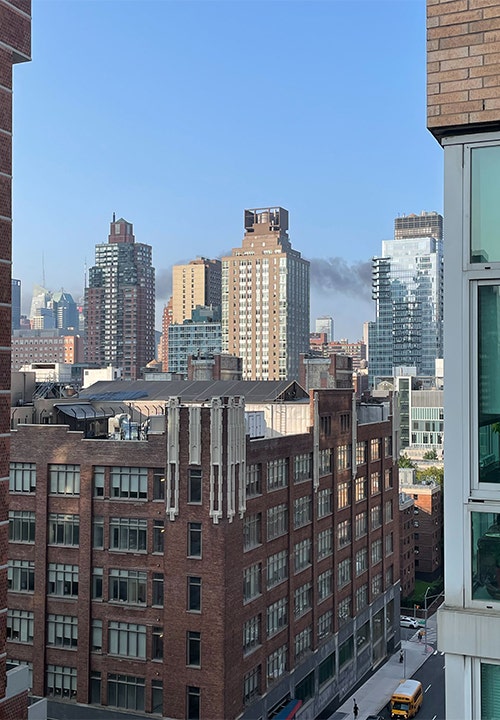 Smoke crossing the New York sky.