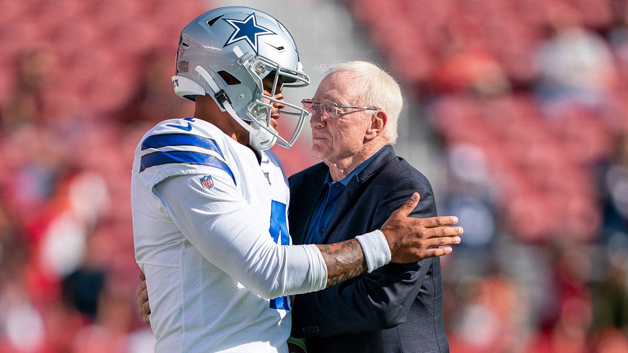 Dallas Cowboys quarterback Dak Prescott talks to Jerry Jones before a game