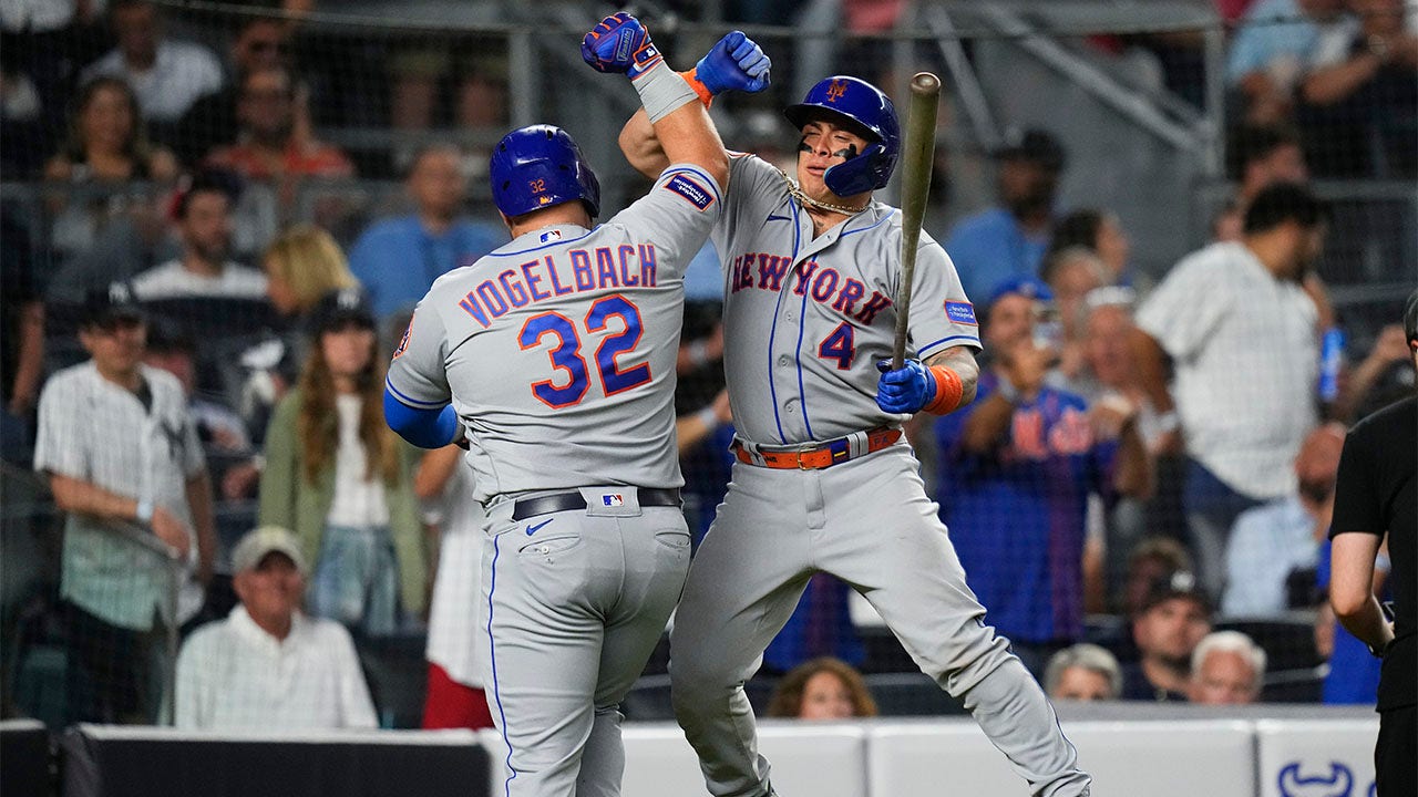 Daniel Vogelback celebrates with Fransisco Alvarez