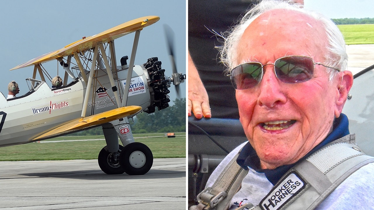 Dream Flights offers flights to veterans on vintage World War II pilot-training biplanes. World War II Navy veteran Don Muncy, 100, is shown on the right right during his flight on July 25, 2023. (Courtesy the Ohio Masonic Communities)