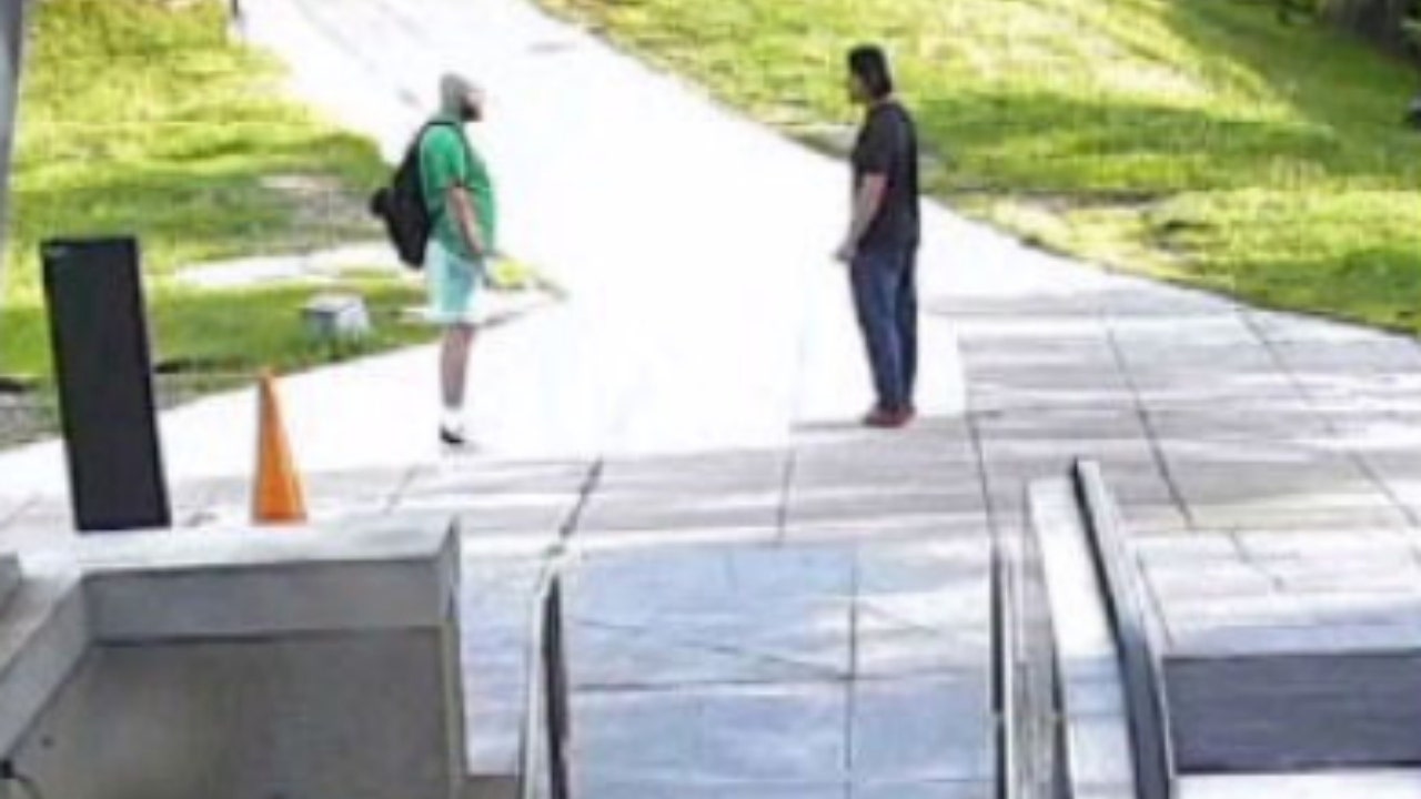 Maxwell Emerson (right) talking to Jaime Macedo (left) outside the Metro station