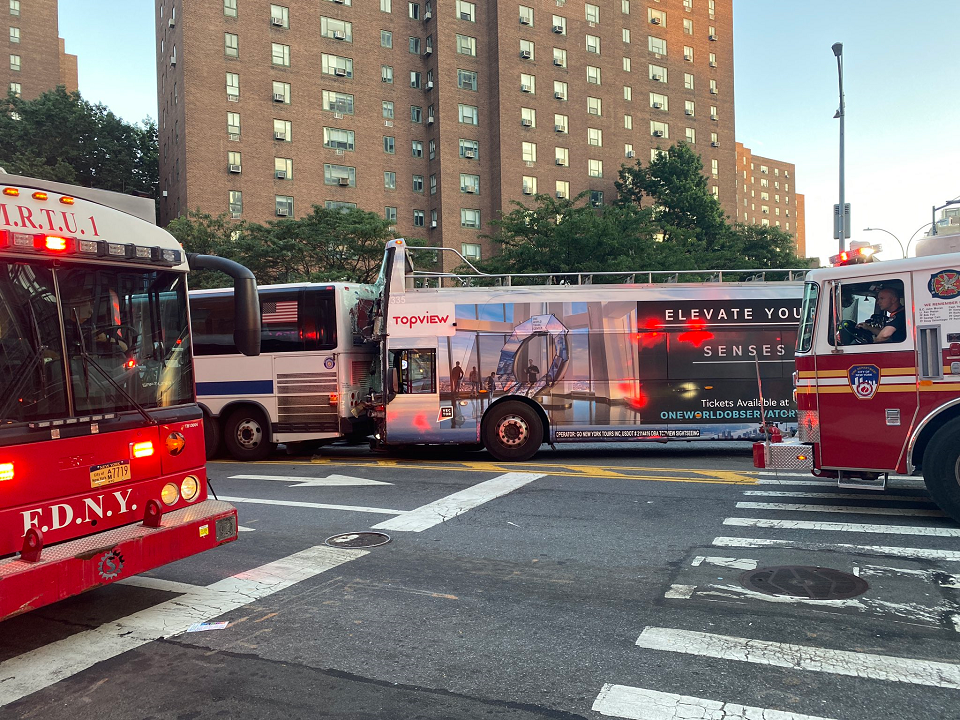 Several cars struck by MTA bus, stacked on top of each other in