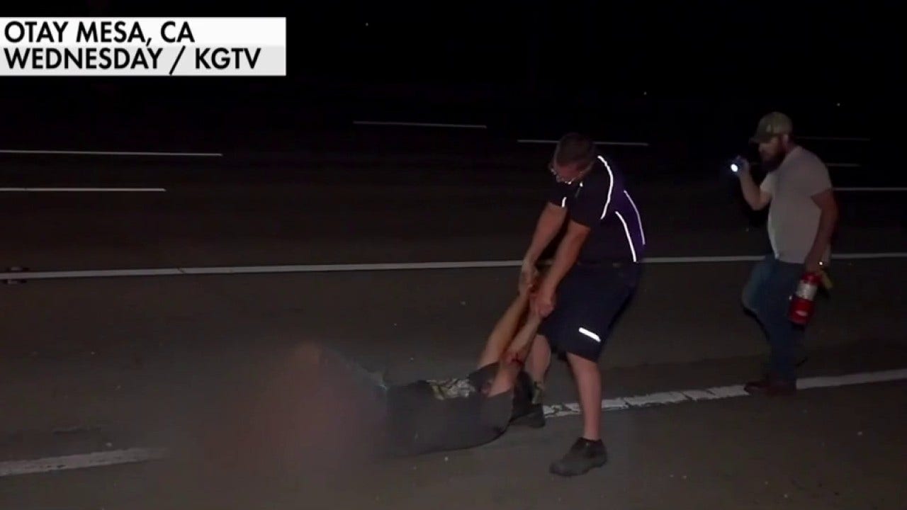 FedEx driver pulls man from burning car
