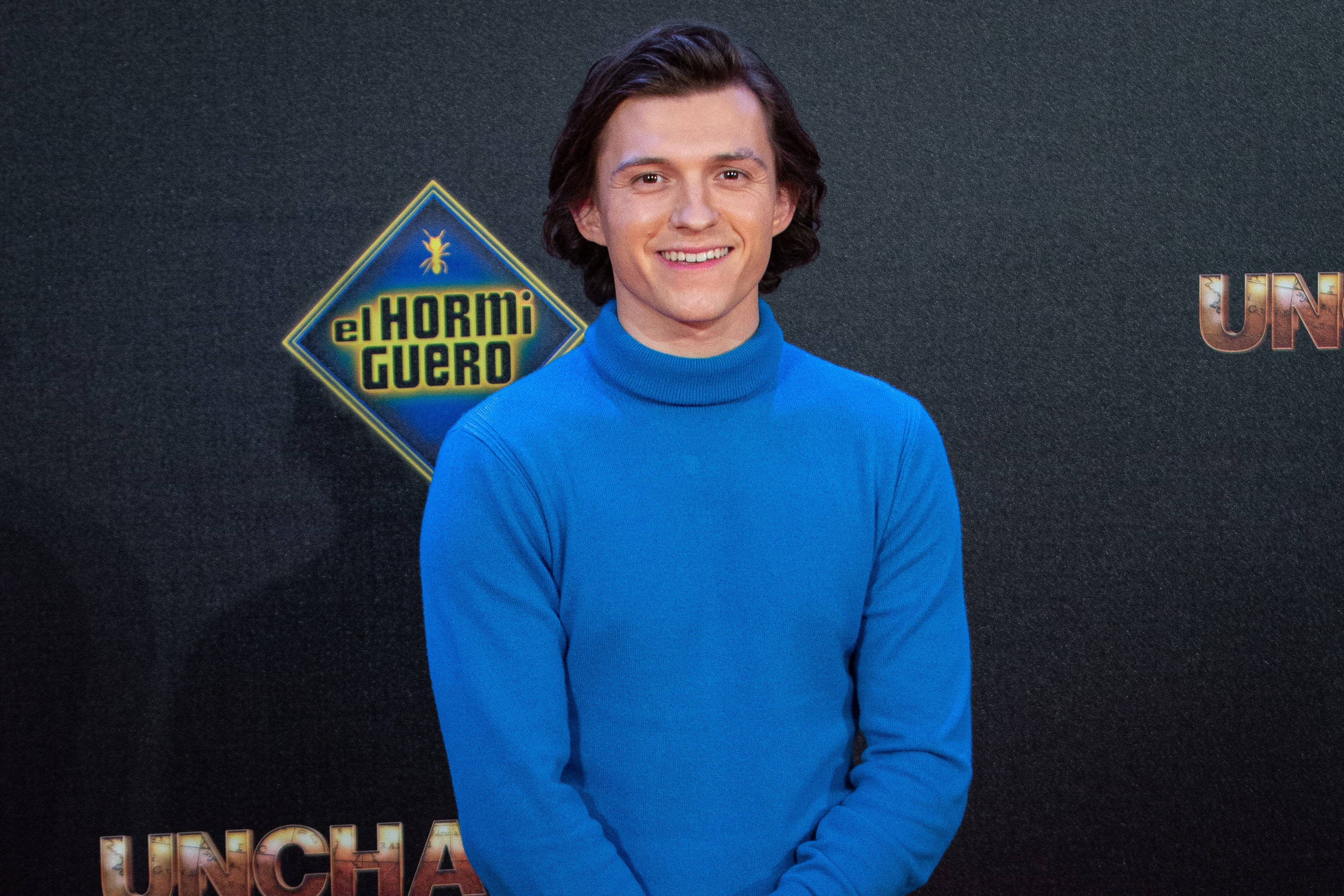 Tom Holland in a blue sweater