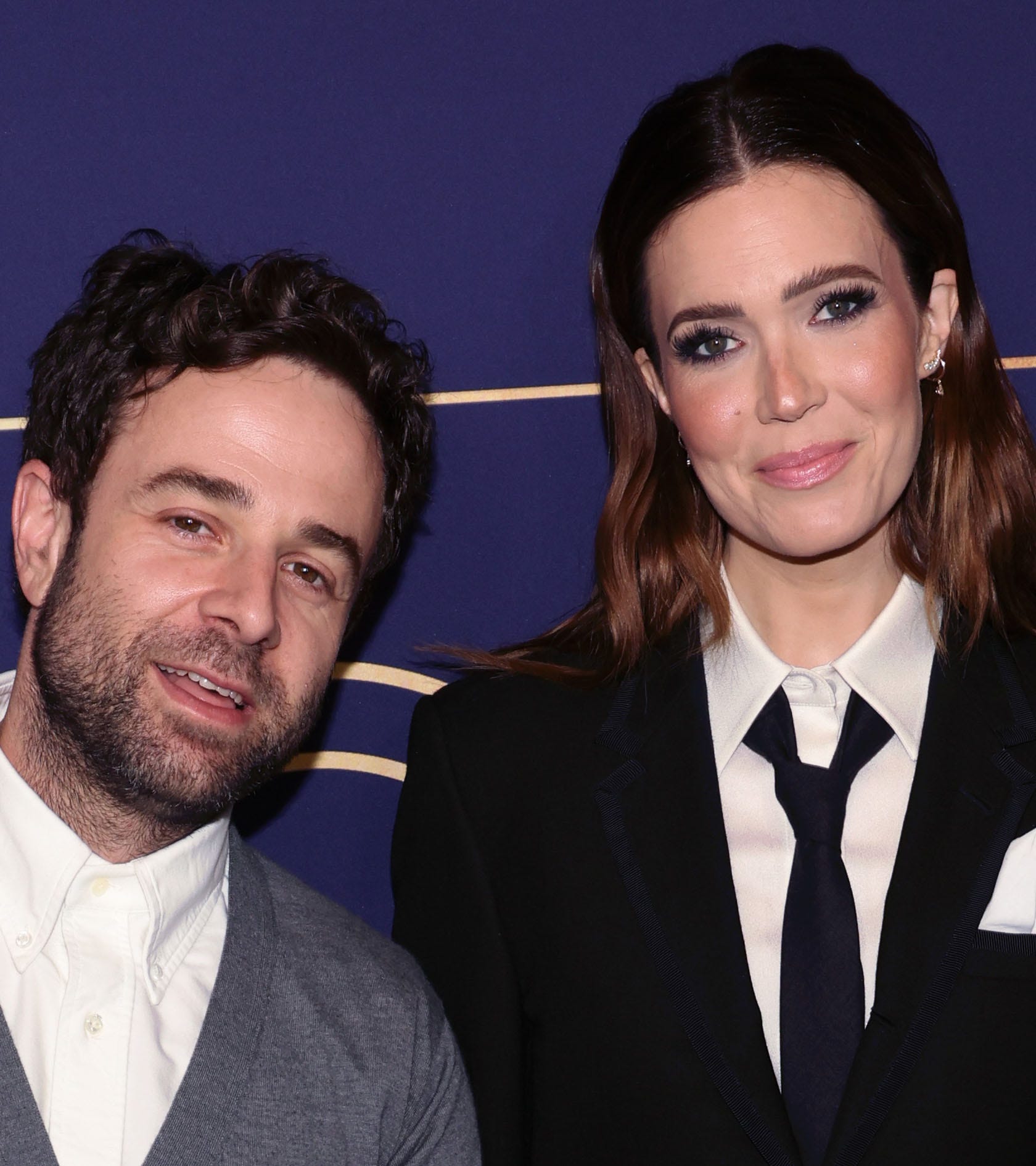 Taylor Goldsmith leans into wife Mandy Moore on the carpet