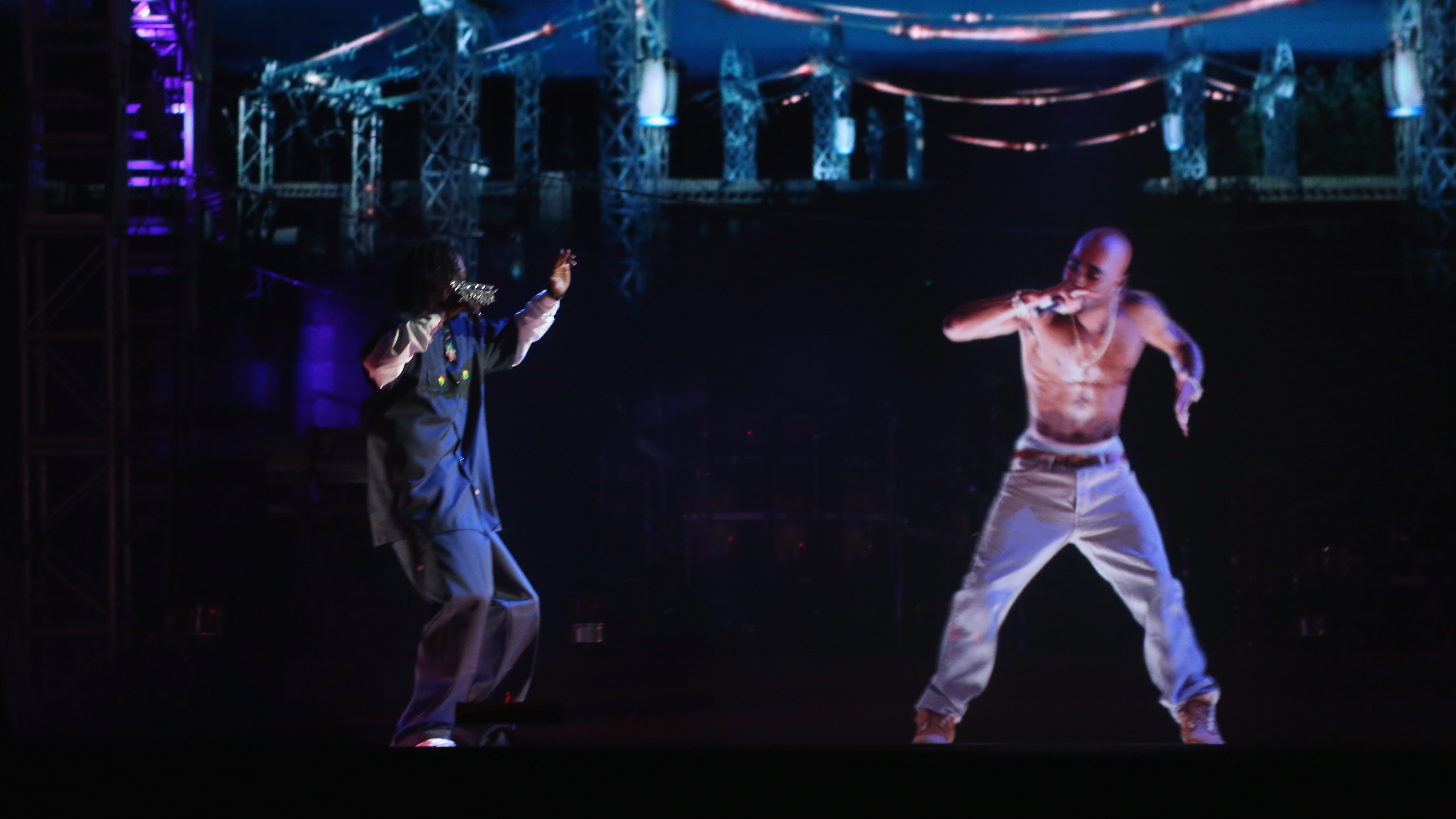Snoop Dogg and a hologram of Tupac Shakur perform on stage at Coachella