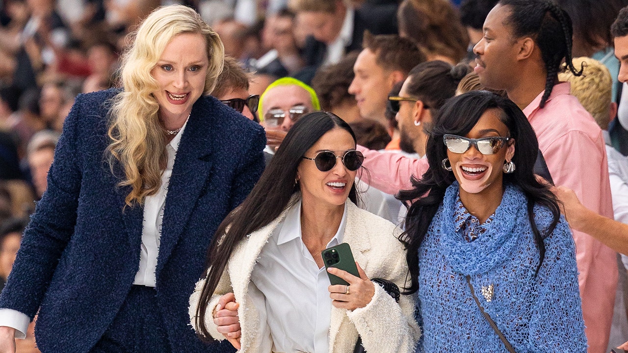 Gwendoline Christie, Demi Moore and Winnie Harlow walking together at Paris Fashion Week
