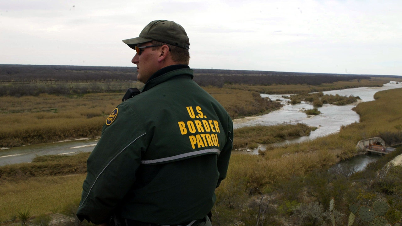 A USBP official by a river