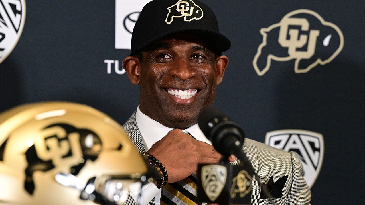 Deion Sanders takes questions from the media.