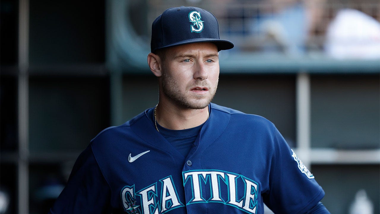 Jarred Kelenic looks on before a game against the Giants