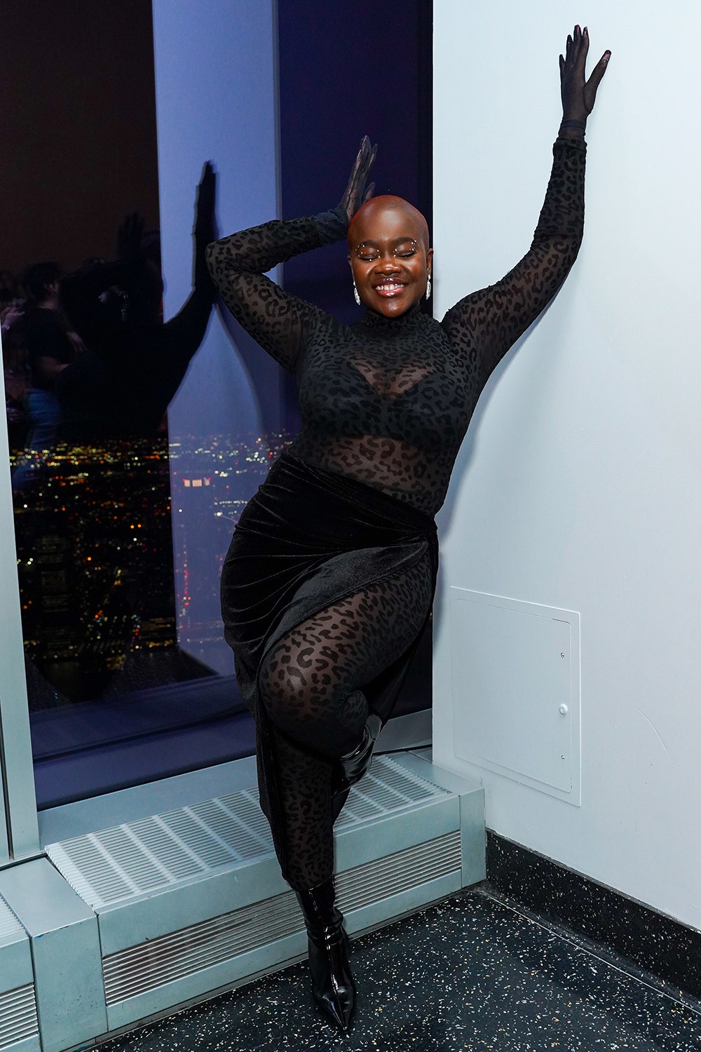 Achieng Agutu wearing a sheer black catsuit