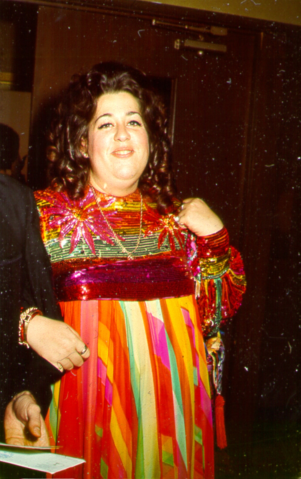 Cass Elliot wearing a colorful dress
