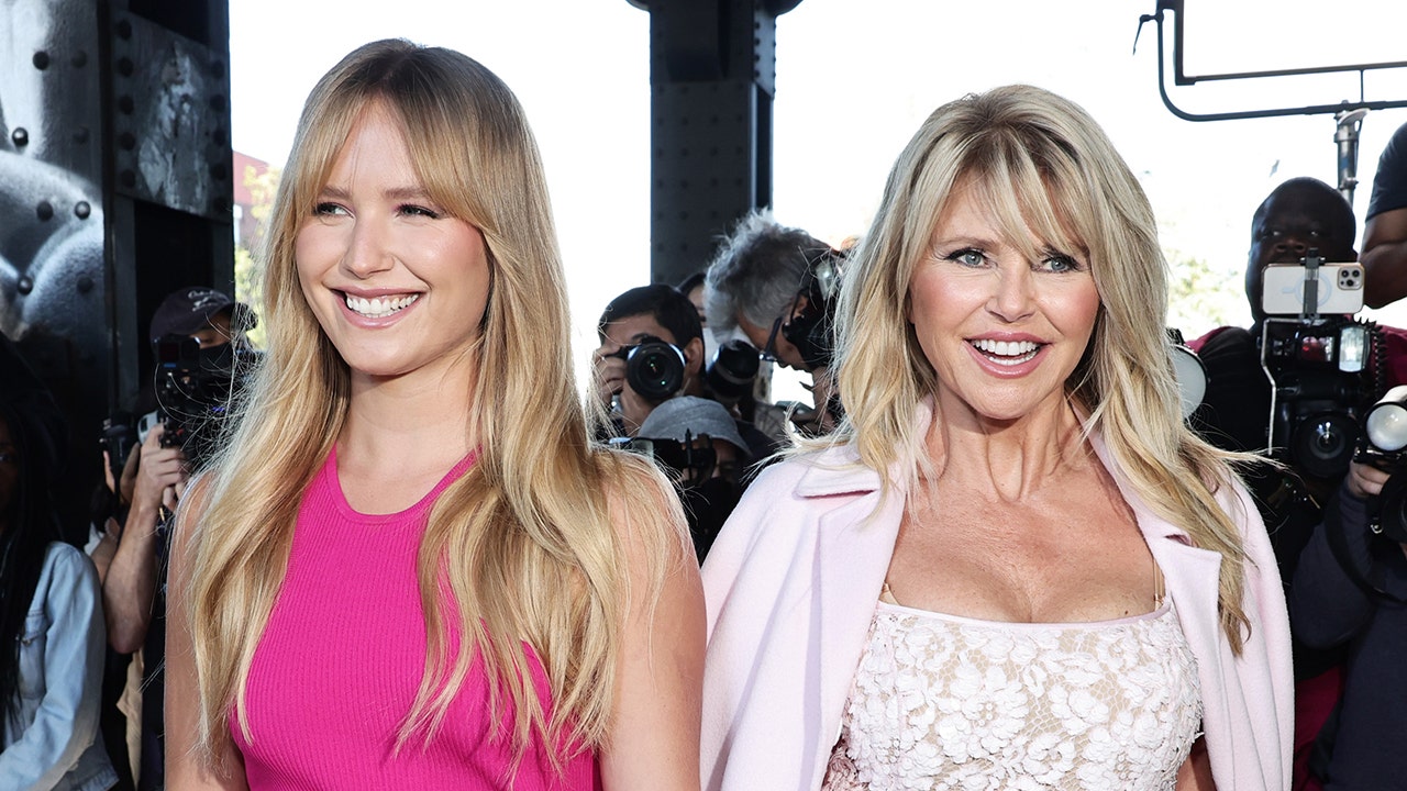 Christie Brinkley and her daughter Sailor Brinkley Cook wearing pink dresses of various shades