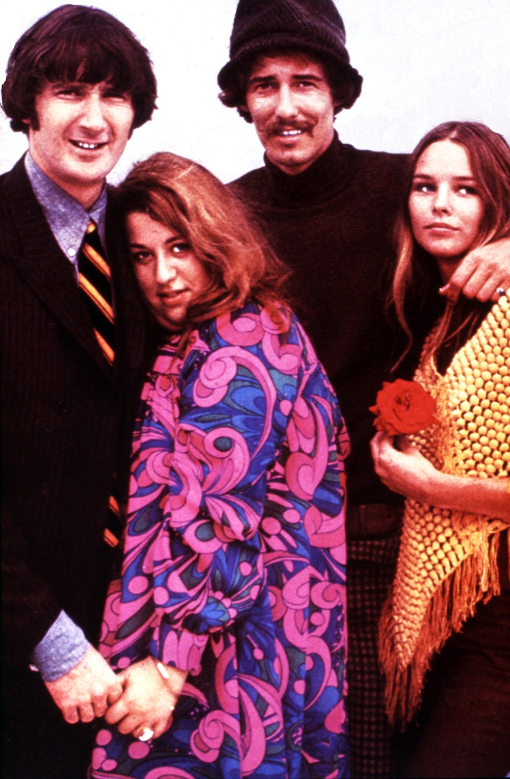 A colored photo of the Mamas and the Papas wearing 60s fashion