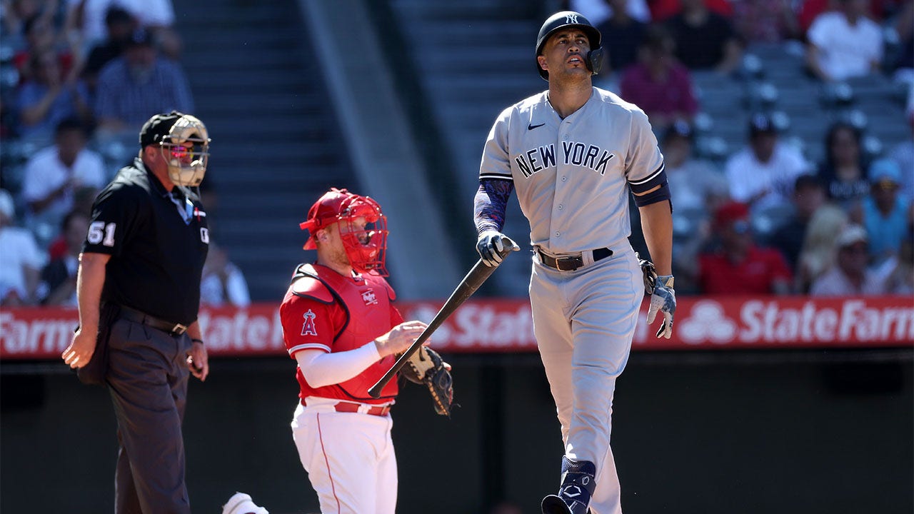Giancarlo Stanton reacts after striking out