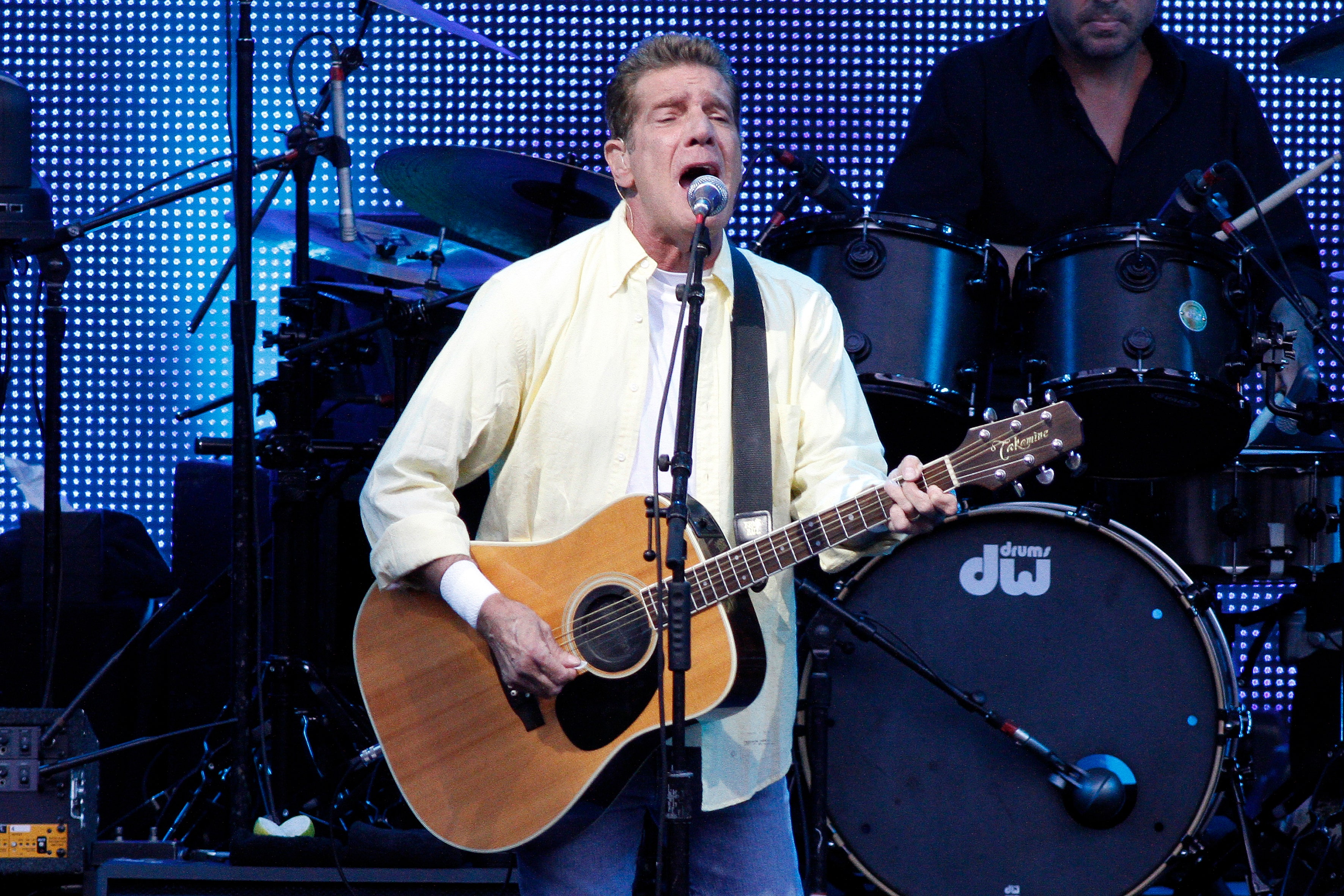 Glenn Frey singing and playing guitar