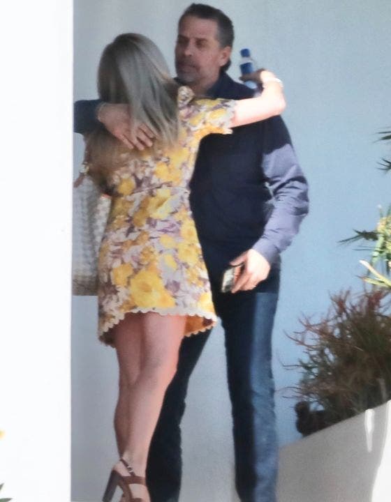 Hunter Biden hugs mystery woman at his lawyer's house