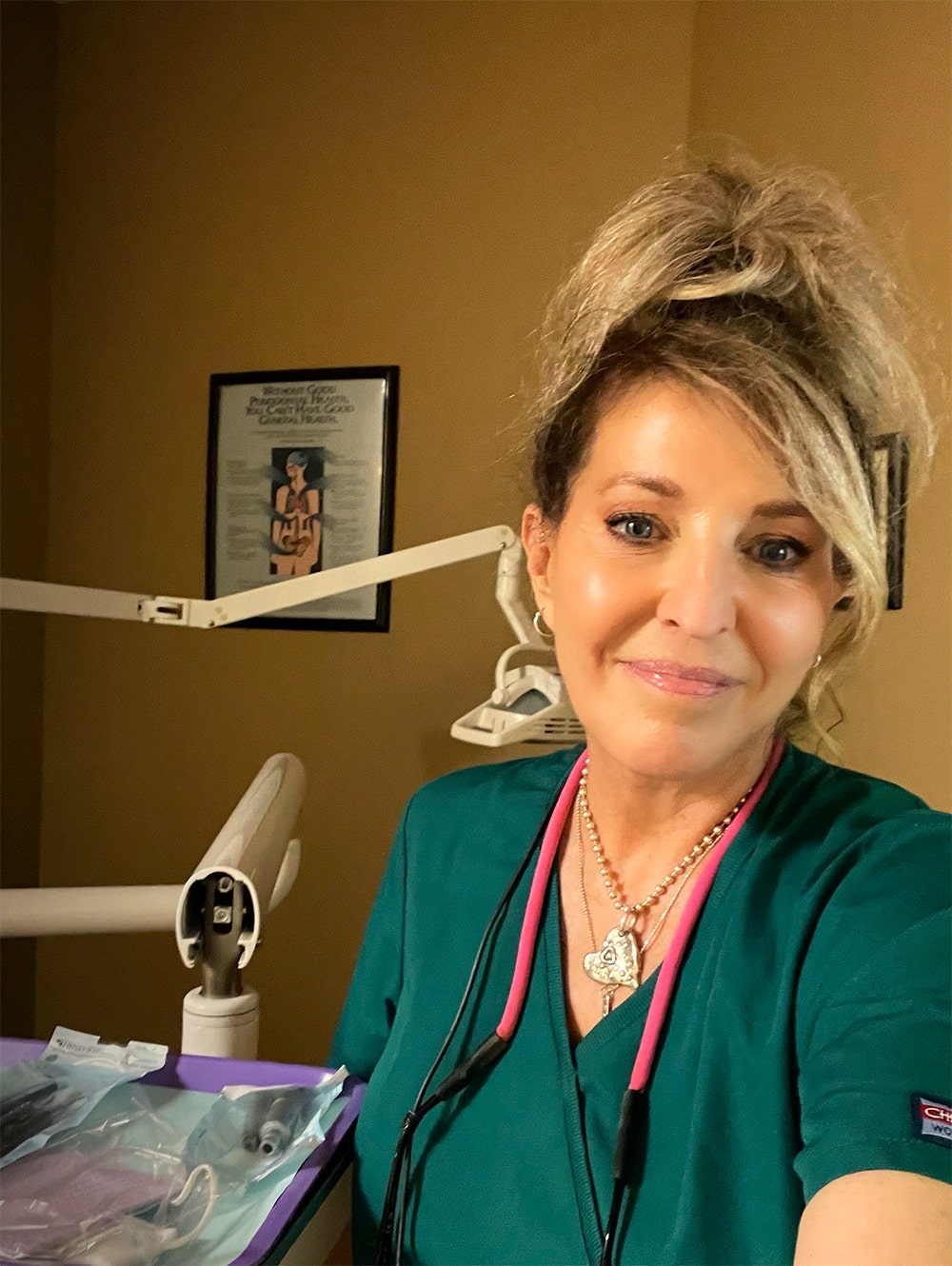 A close-up of Janet Gardner as a dental hygienist