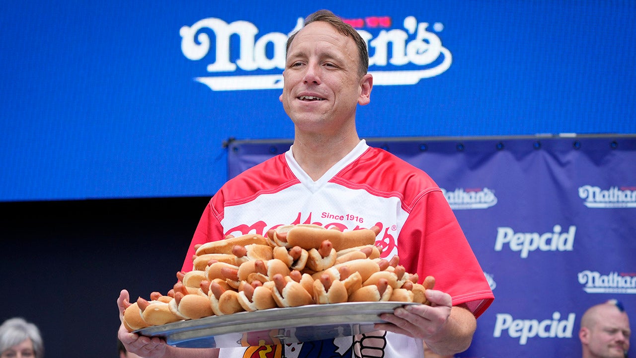 Joey Chestnut wins men's hot dog eating contest after weather delay