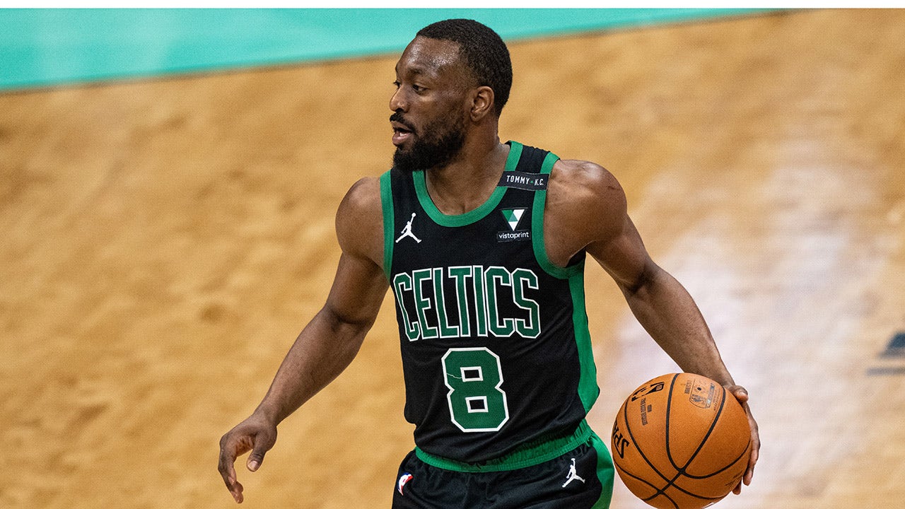 Kemba Walker brings the ball up the court