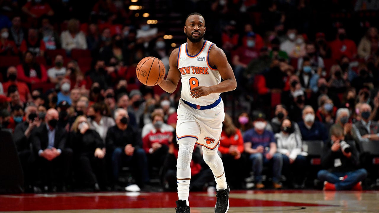 Kemba Walker brings the ball up the court