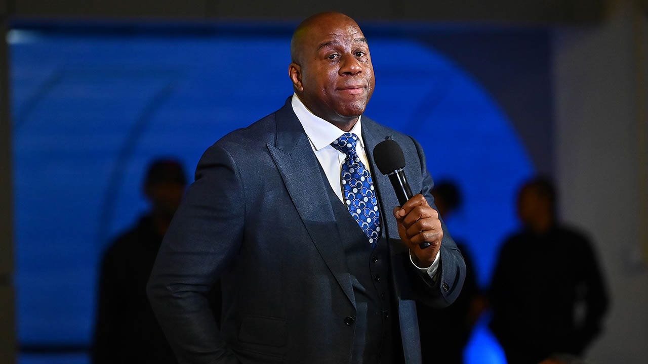 Magic Johnson speaks at an event