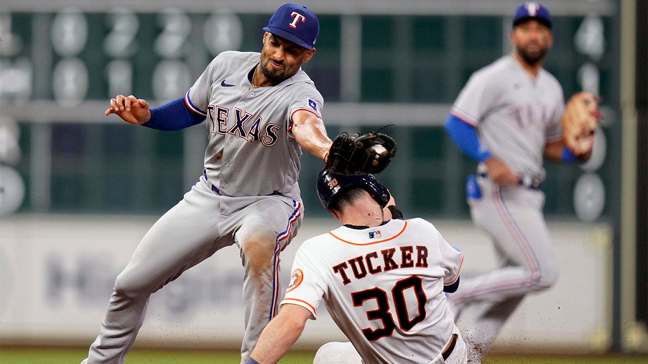 Kyle Tucker steals second base