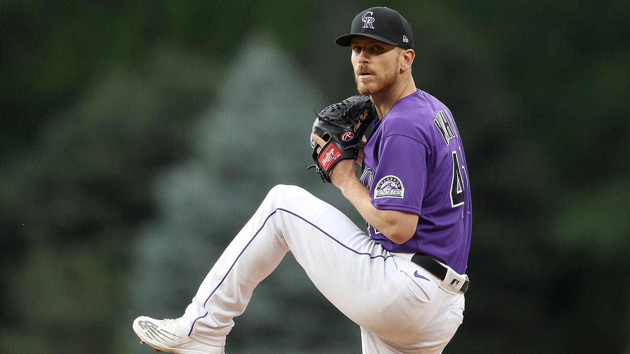 Chad Kuhl pitches for the Colorado Rockies
