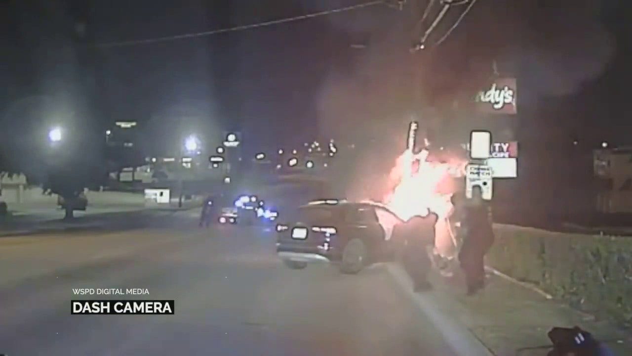 man pulled from burning car