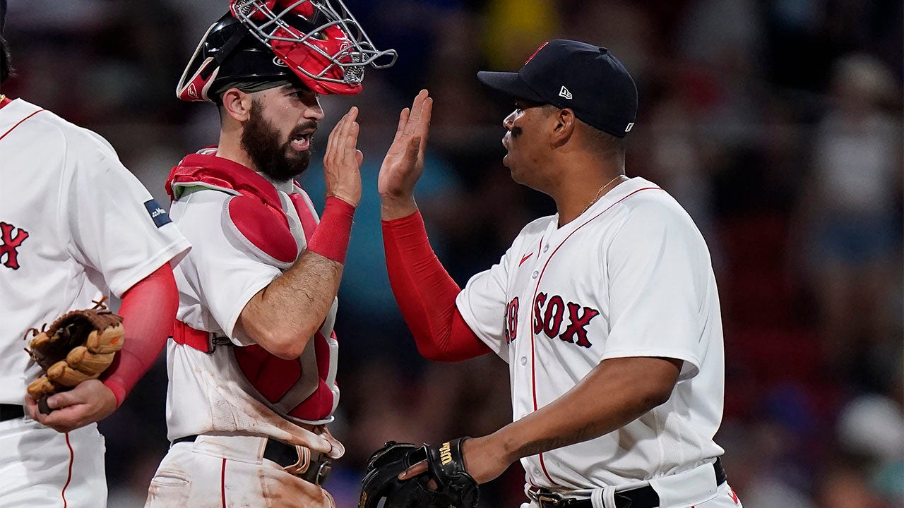 Connor Wong celebrates with Rafael Devers