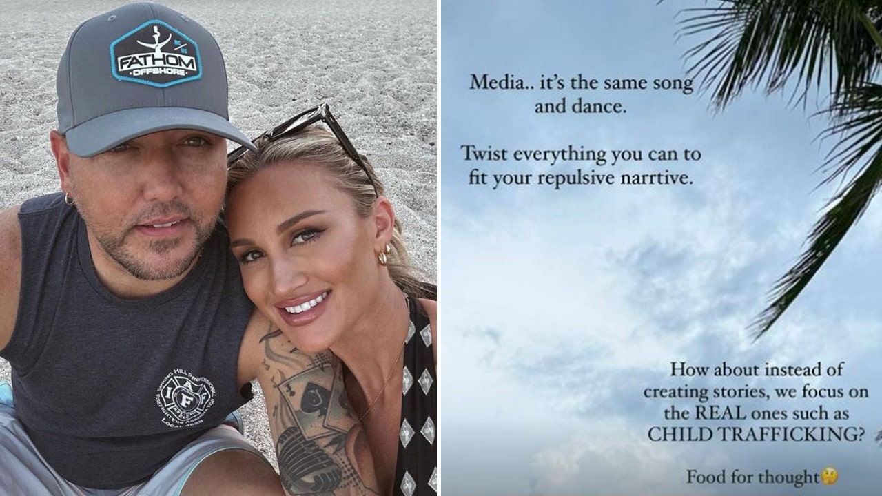 Brittany Aldean smiles on the sand with Jason Aldean