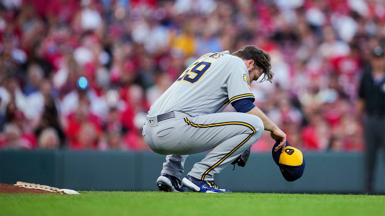 Corbin Burnes and Willy Adames of the Milwaukee Brewers receive