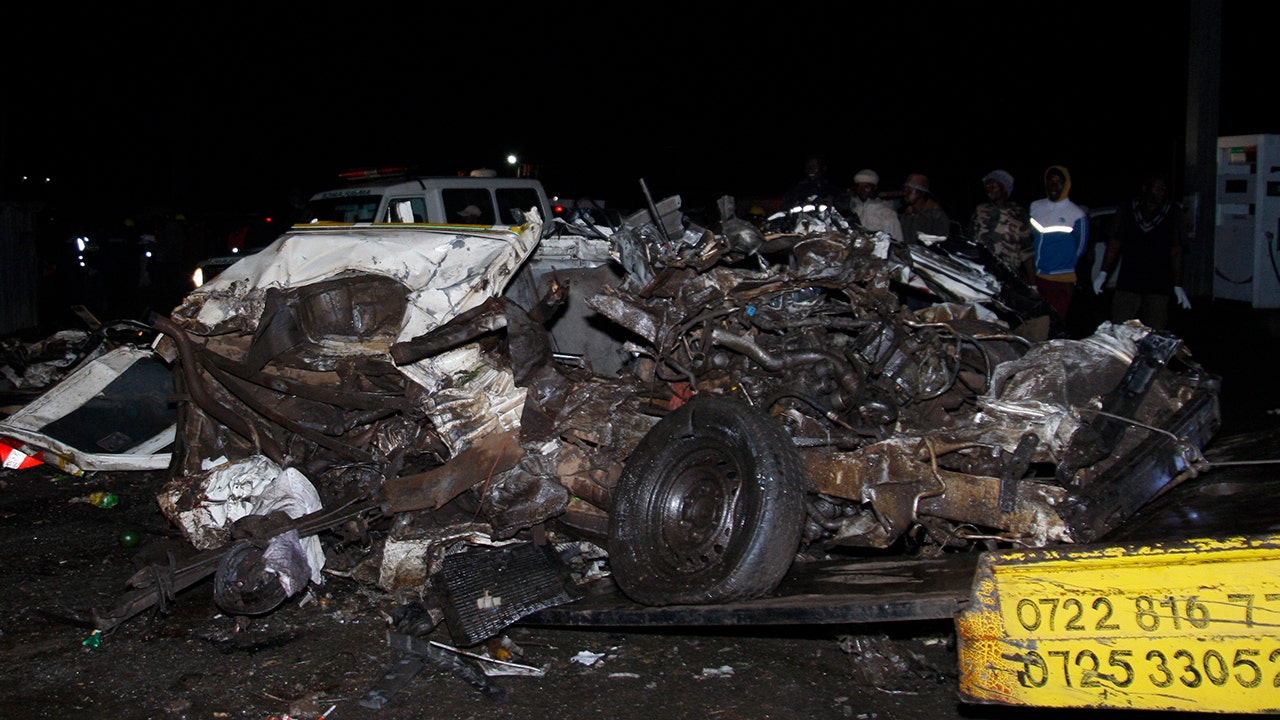 A mangled mass of steel lays at the site of a fatal collision in Kenya