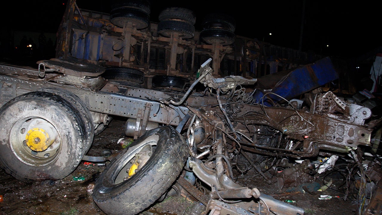 The wreckage of vehicles lies on the ground after a fatal accident in Londiani, Kenya