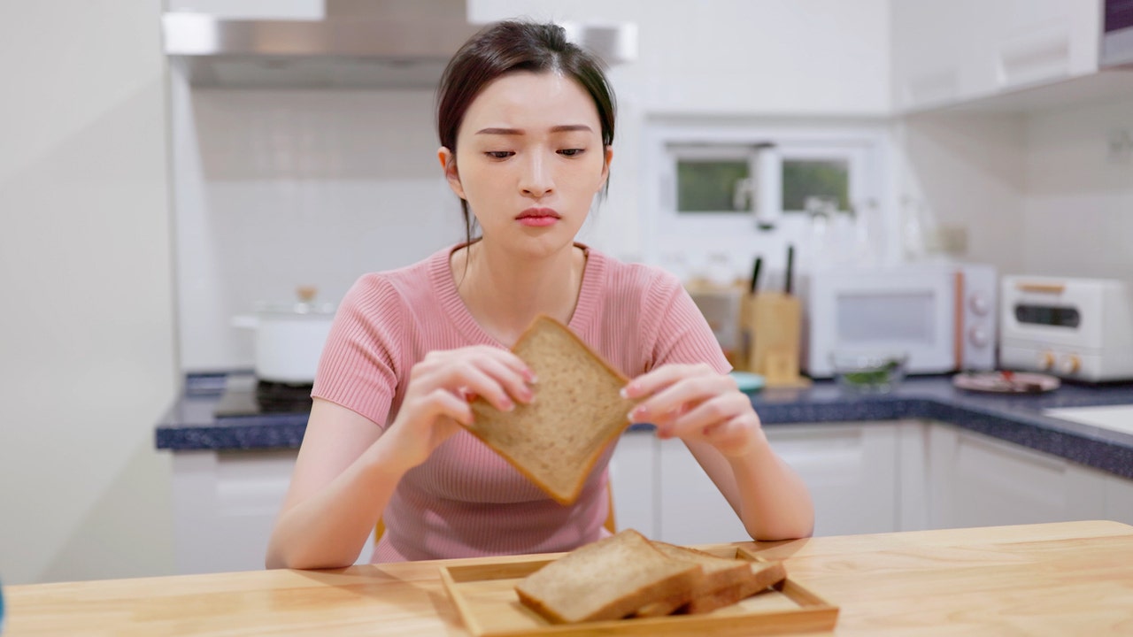 Girl eating bread