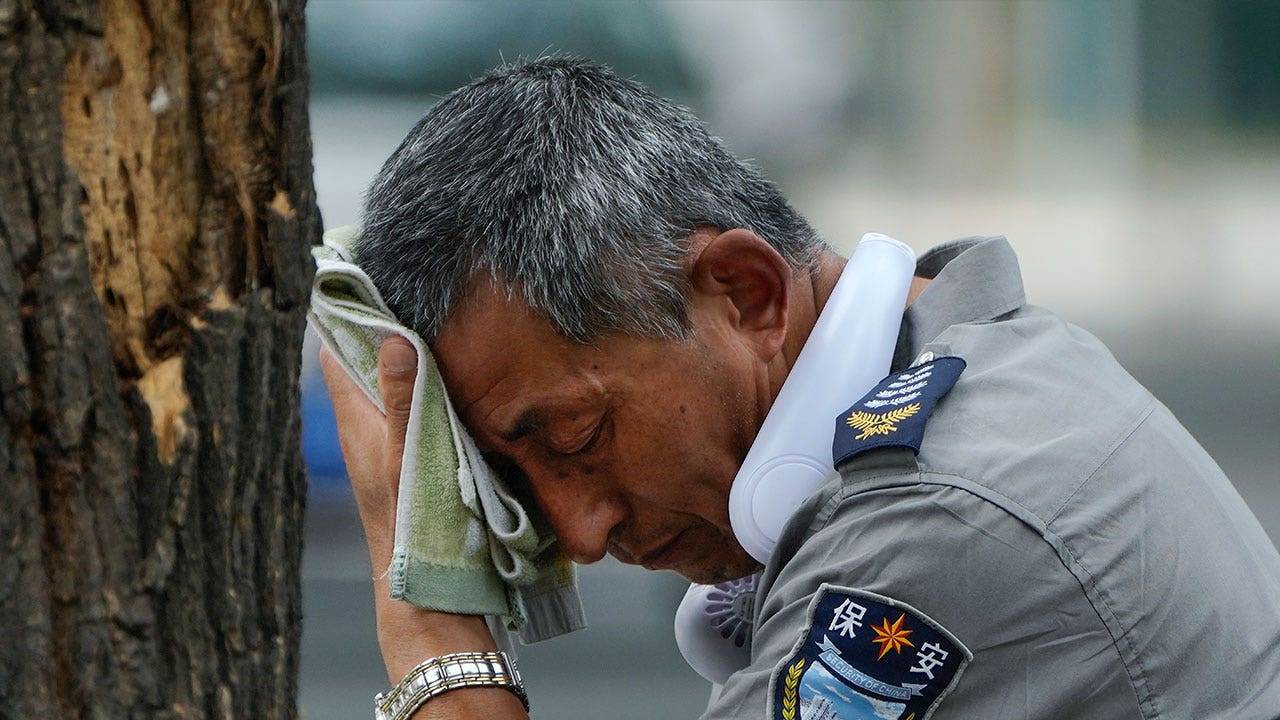 Heavy flooding relieves China from sweltering heat, but displaces over 10,000 residents