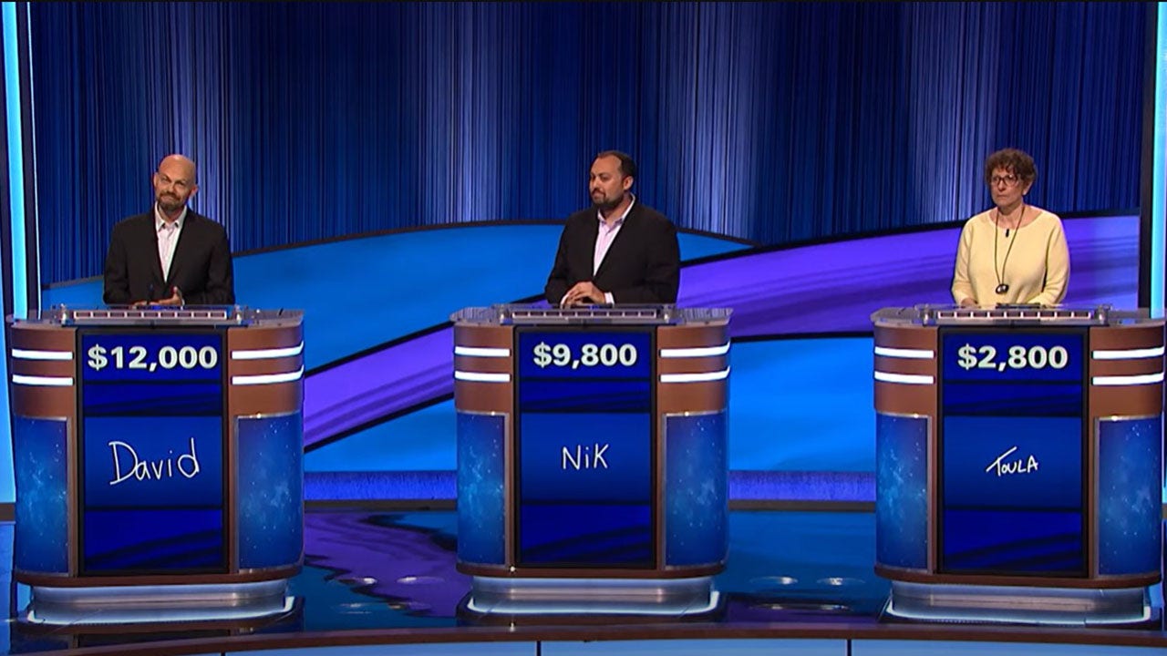 A photo of "Jeopardy!" contestants appearing during the show together